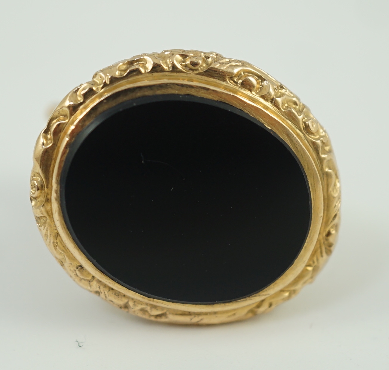 An early 20th century gold overlaid and black onyx set oval fob seal